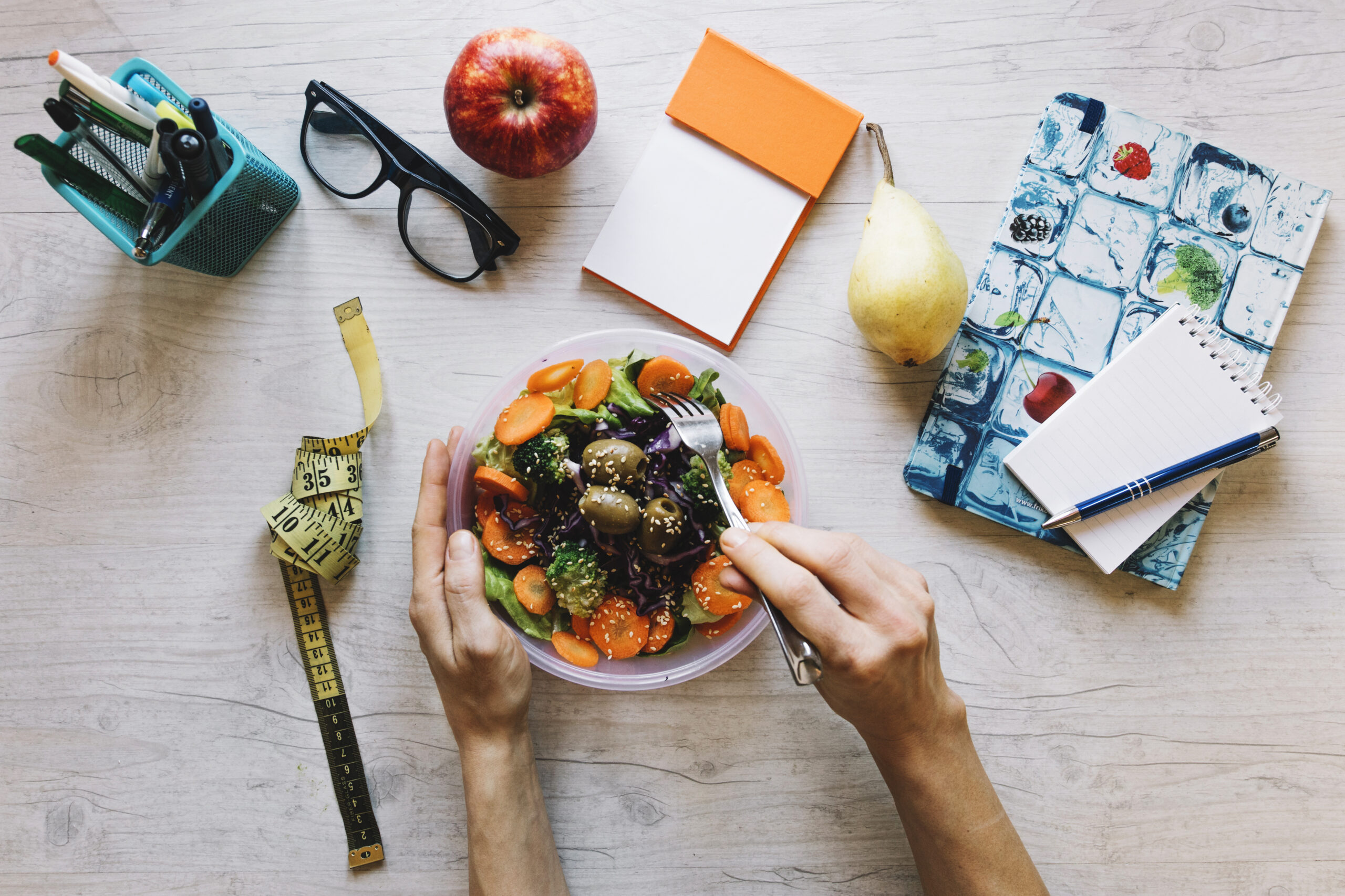 Crop Hands Mixing Salad With Fork