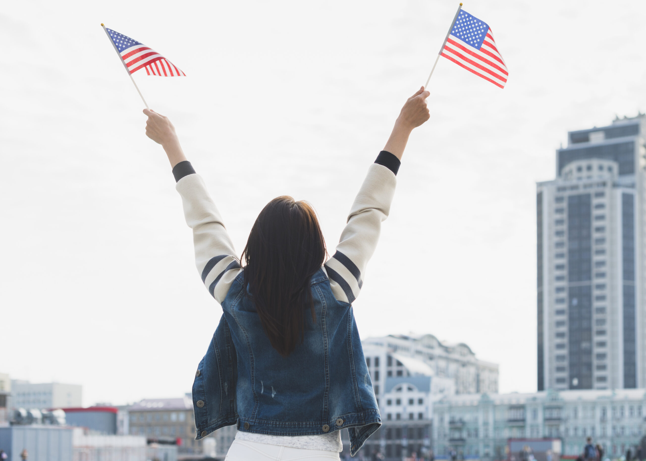 Woman Waving American Flags Hands